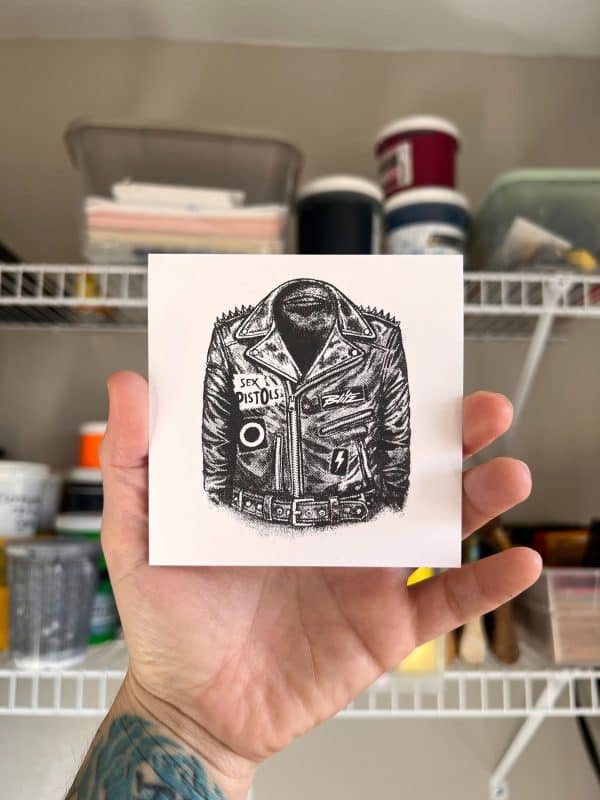 Hand-pulled punk leather jacket screen print with studs and classic punk patch-inspired halftone artwork, printed in a single color on 100lb paper.