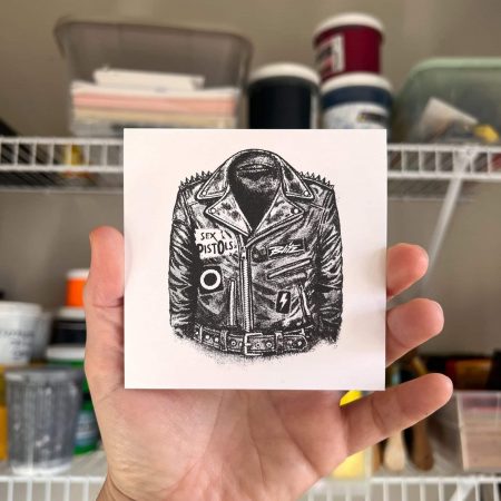 Hand-pulled punk leather jacket screen print with studs and classic punk patch-inspired halftone artwork, printed in a single color on 100lb paper.